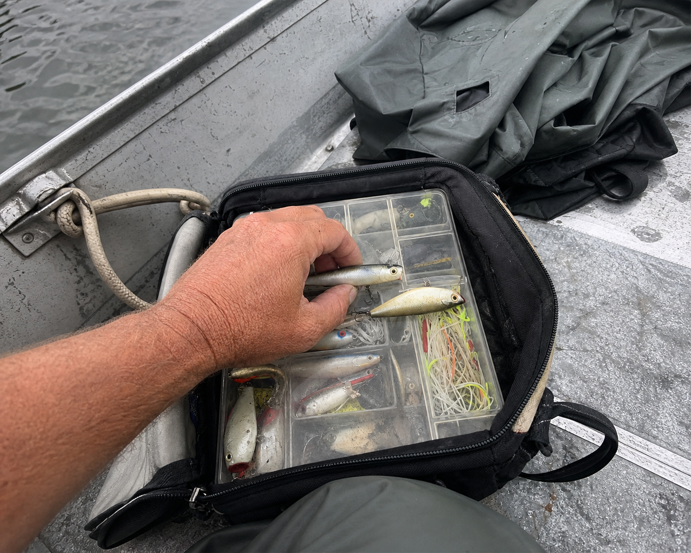A selection of surface lures in an open tackle tray