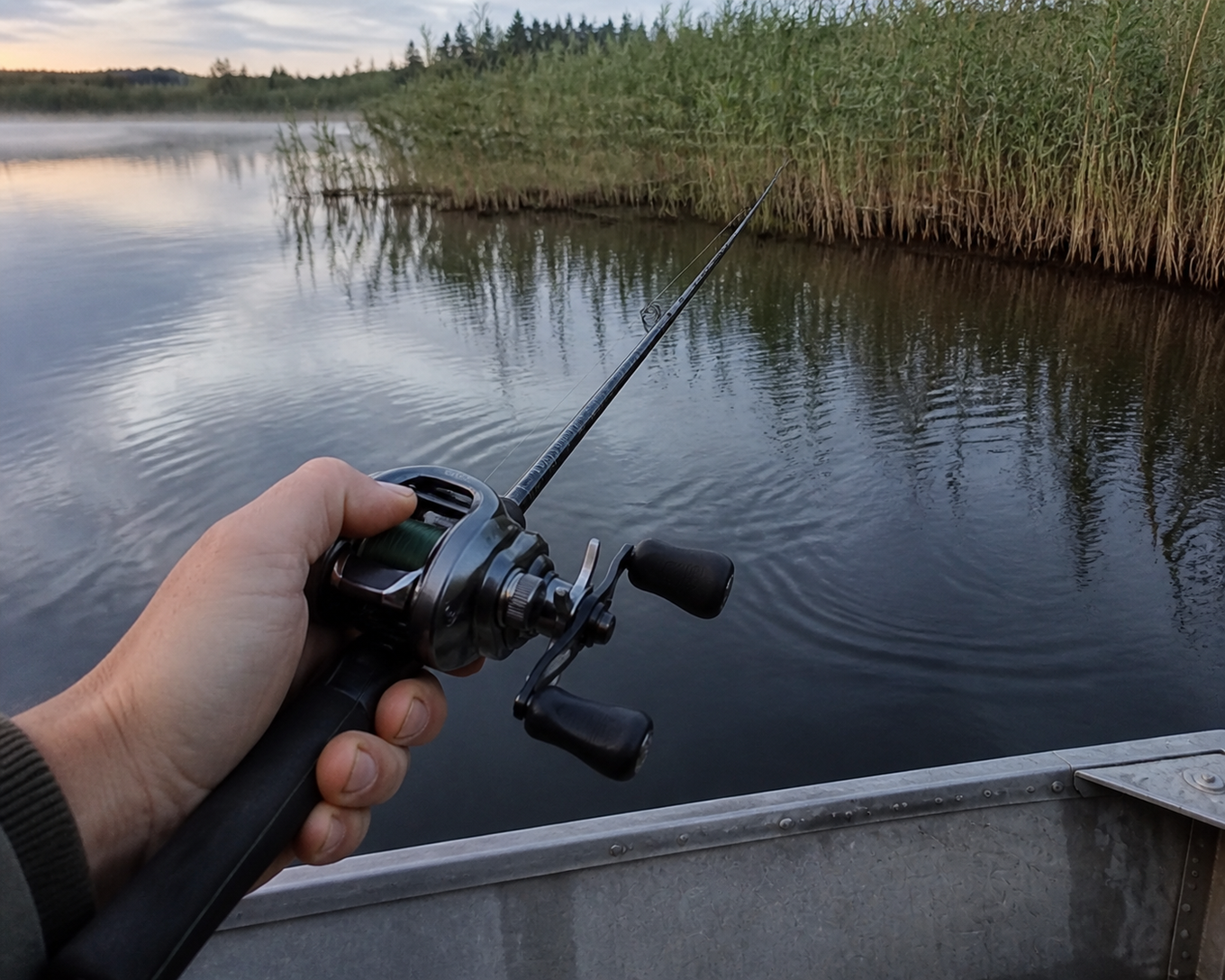 Angler choosing a deliberately slow retrieve along a reed edge